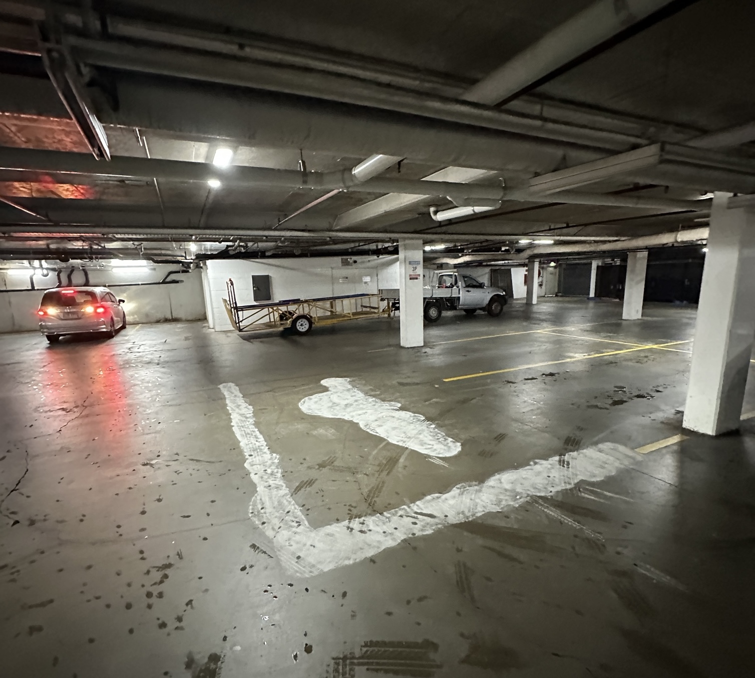 Underground car park with old markings ground away before remarking