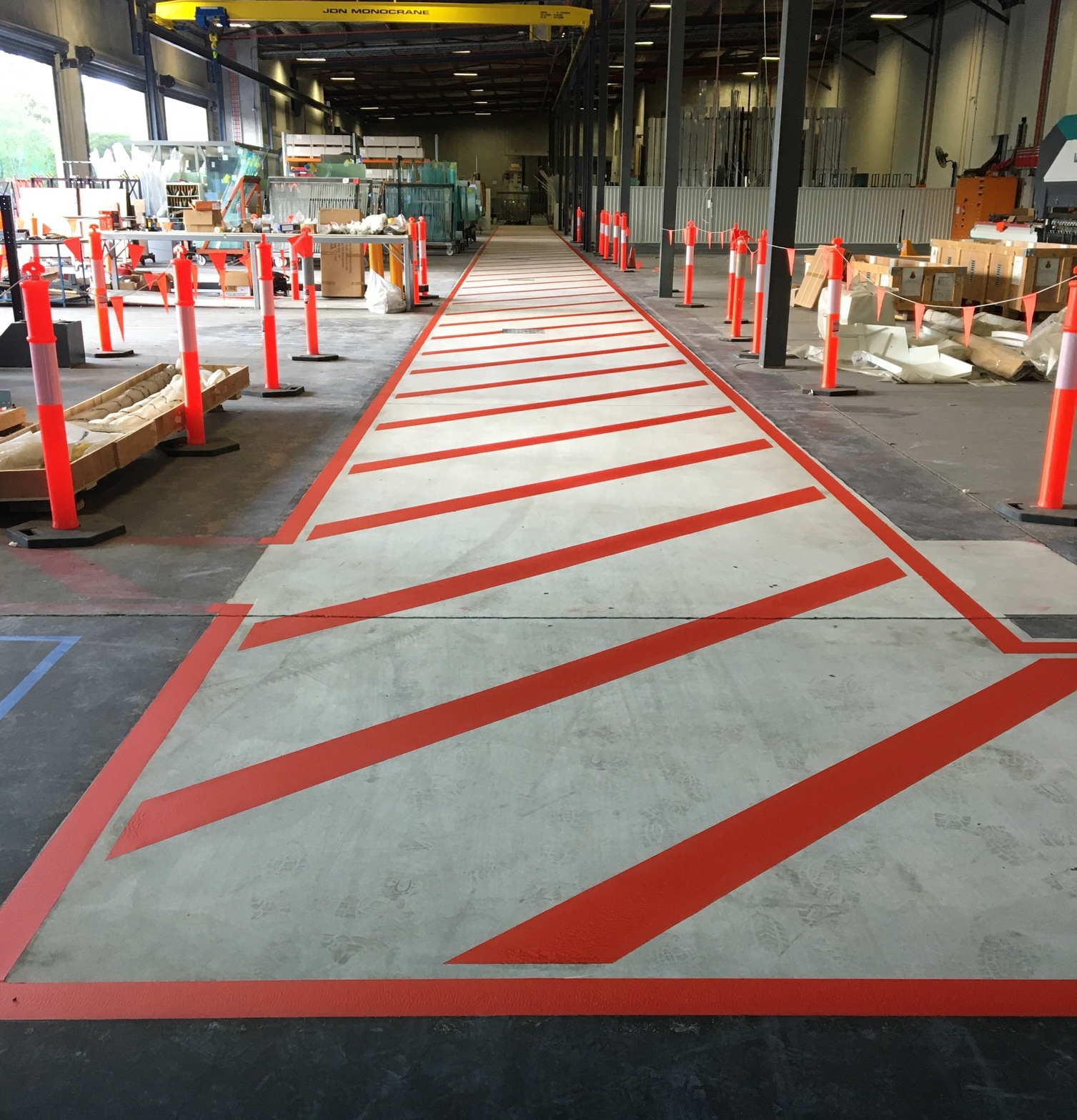 Red hatched exclusion zone through a manufacturing facility