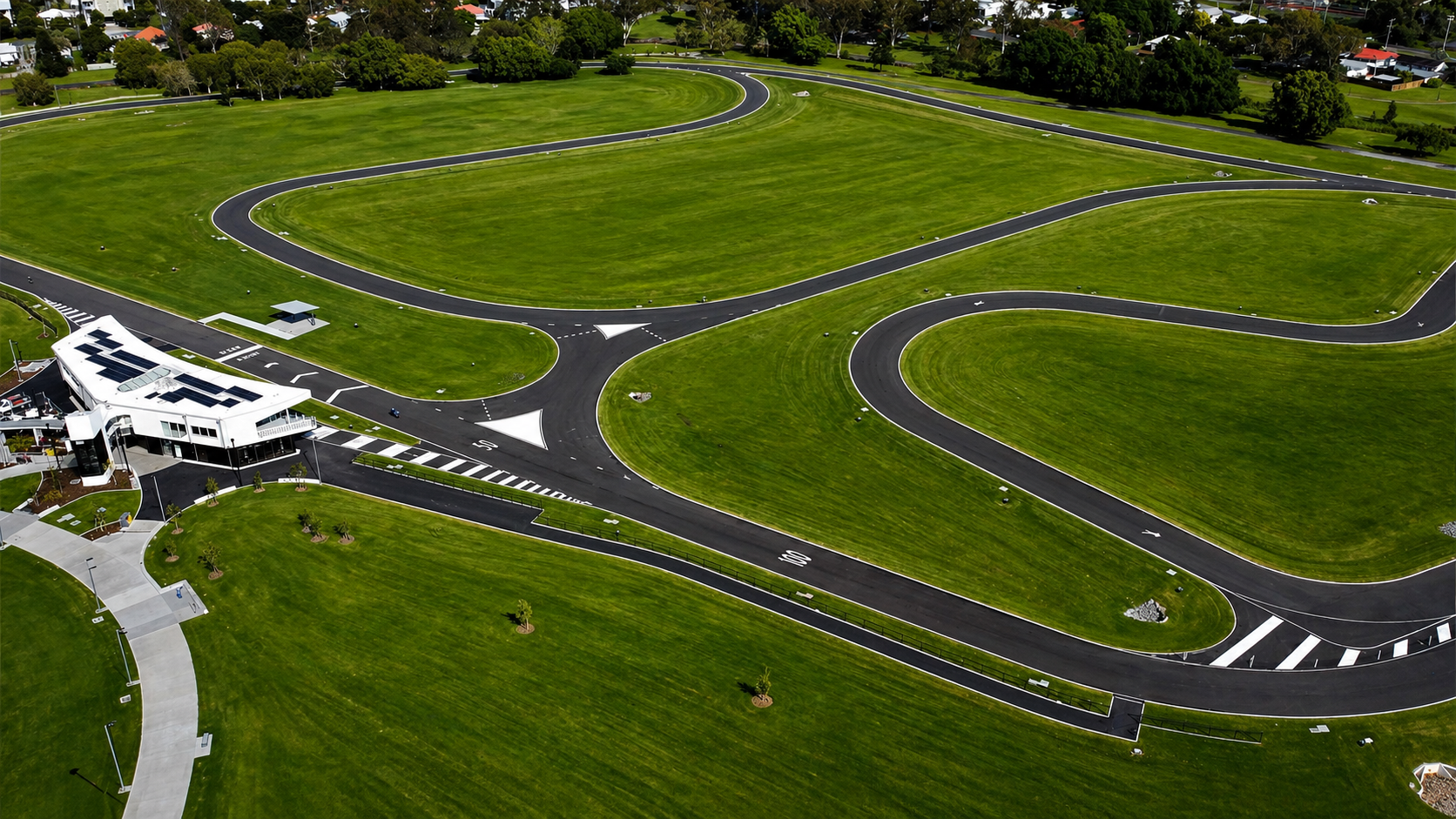 Sweeping aerial view of a marked driver training facility
