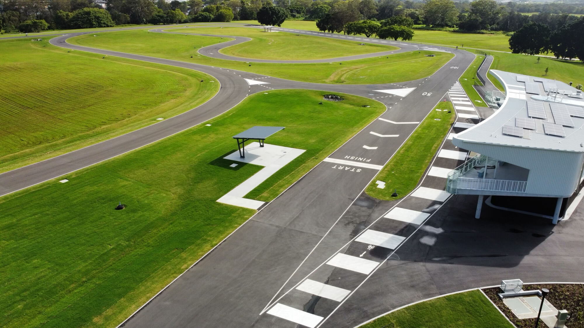 Aerial view of driver training track with start, finish and pedestrian crossings