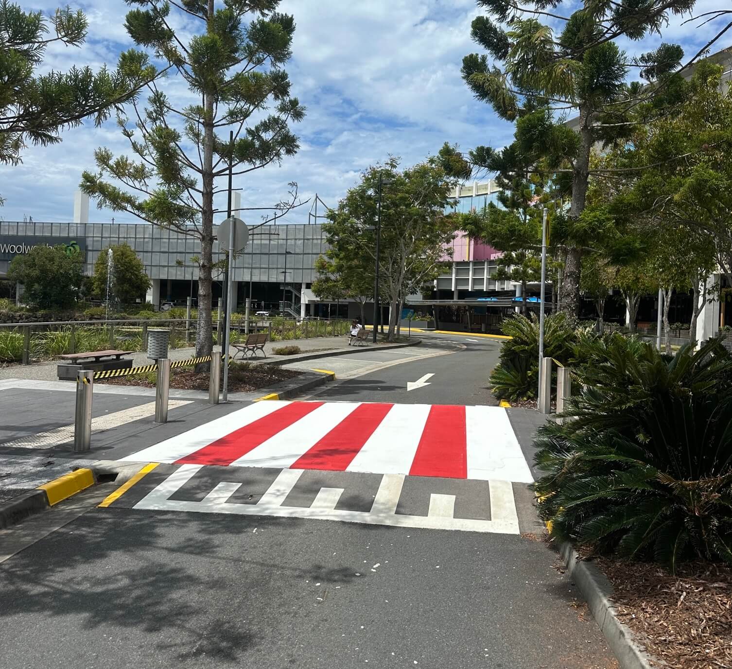 Commercial precinct raised pedestrian crossing in red and white line marking