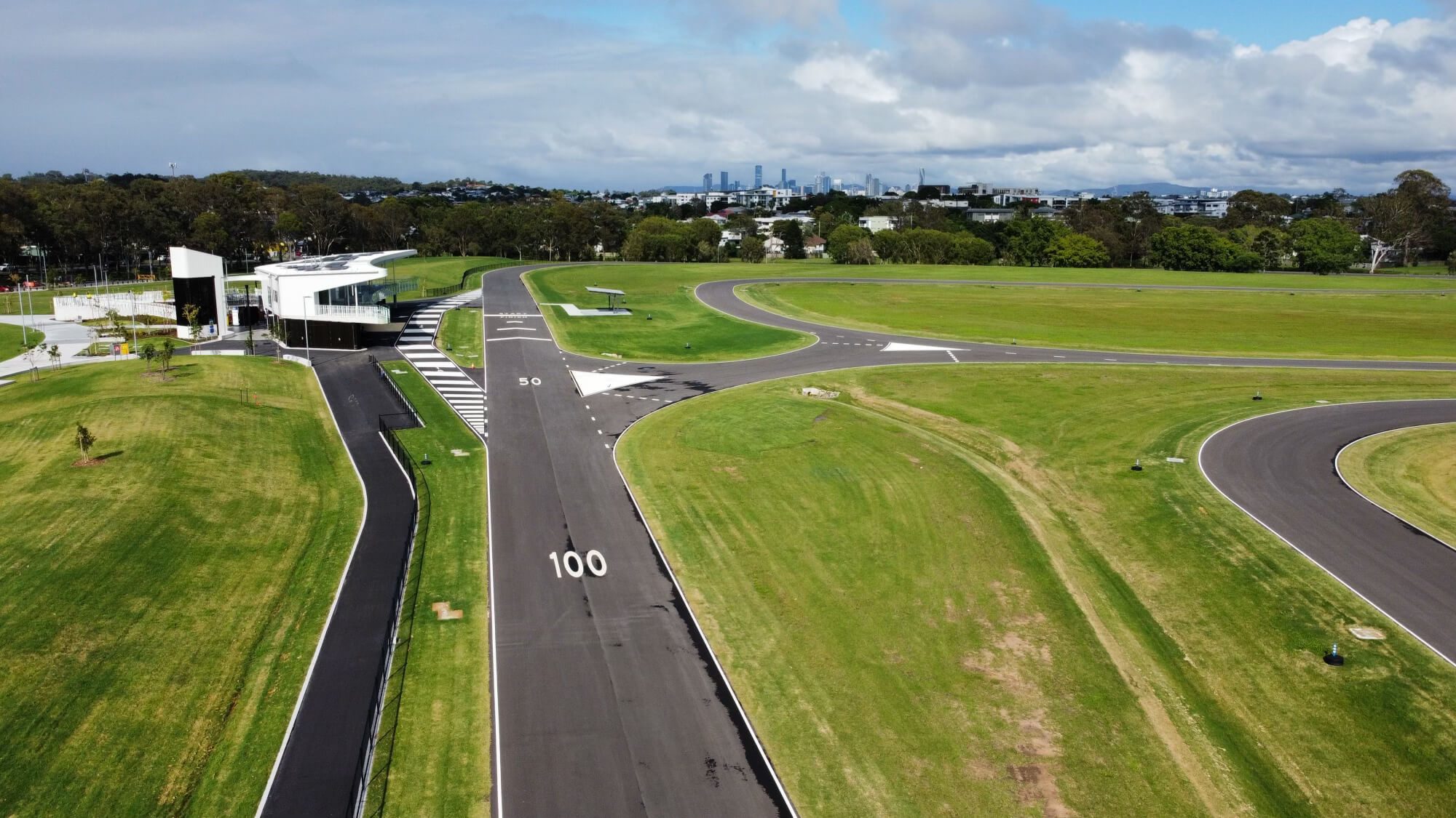Aerial view of driver training track with numbered speed zones and line marking