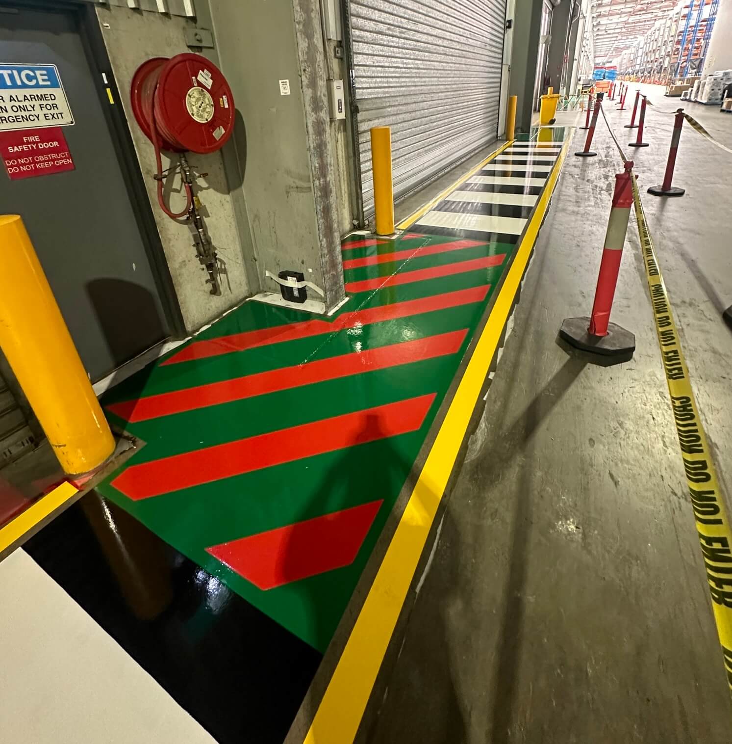 Warehouse loading dock red and green chevron safety zone line marking