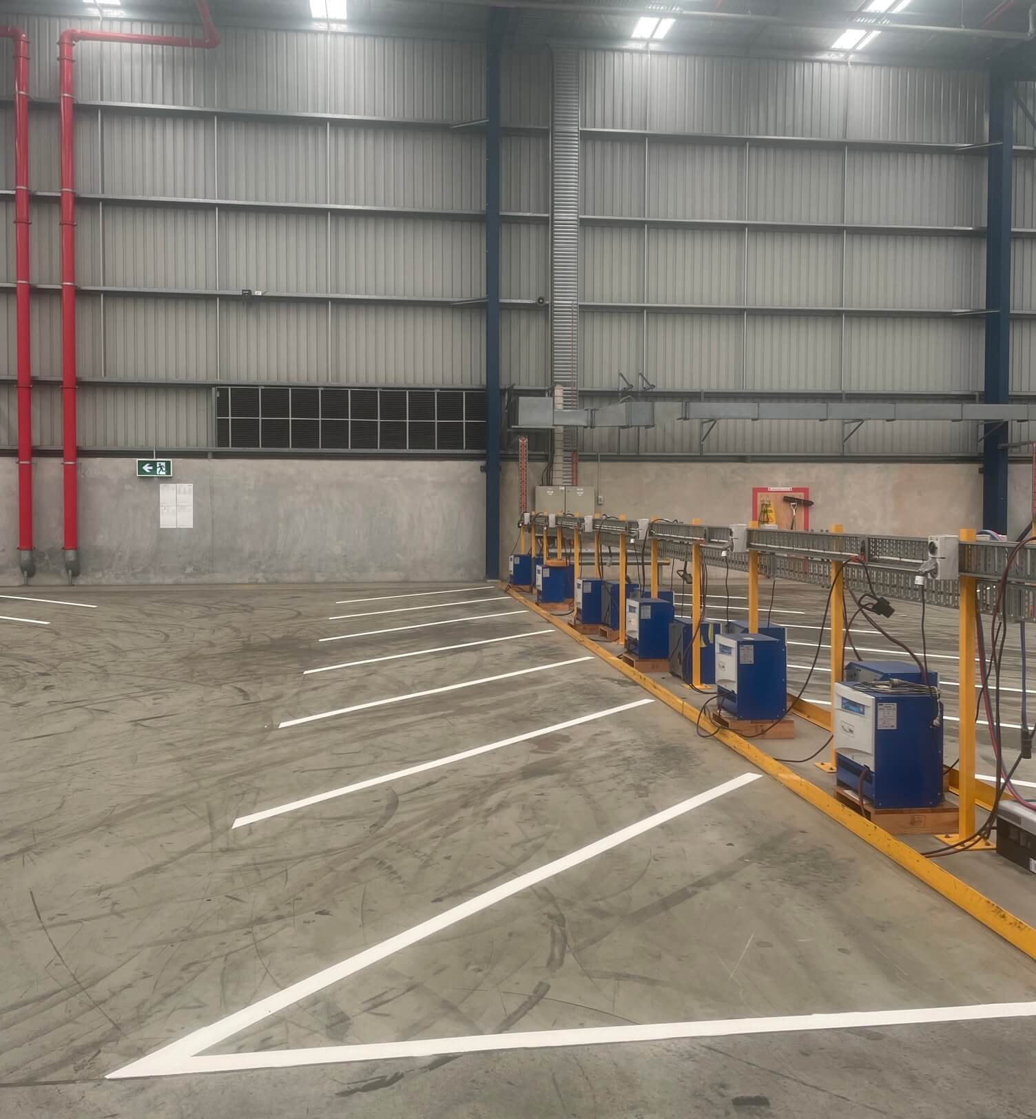 Industrial warehouse floor with white parking bay line marking