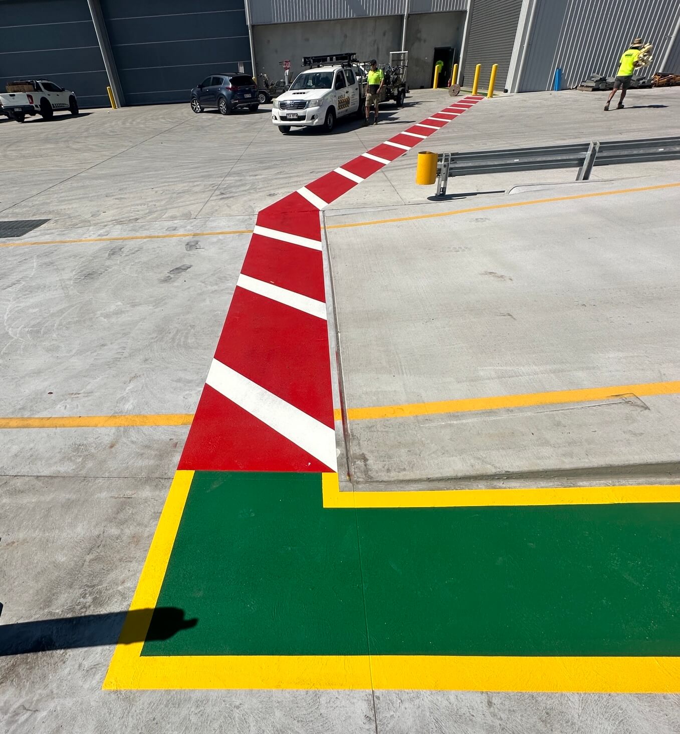 External warehouse safety zone line marking in red, green and yellow