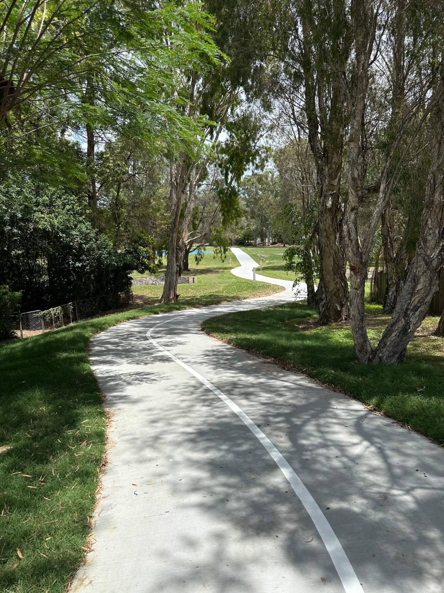Brisbane council shared path through parkland with fresh white edge line marking