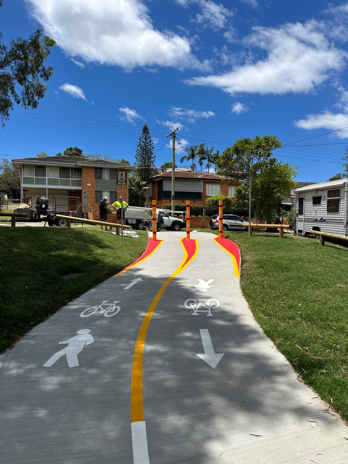 Brisbane residential shared path with bike and pedestrian lane marking and bollards